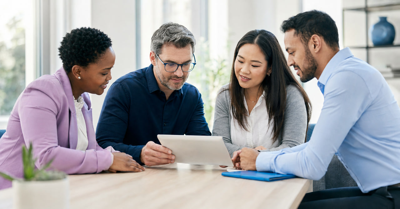 Colleagues talking together in an office