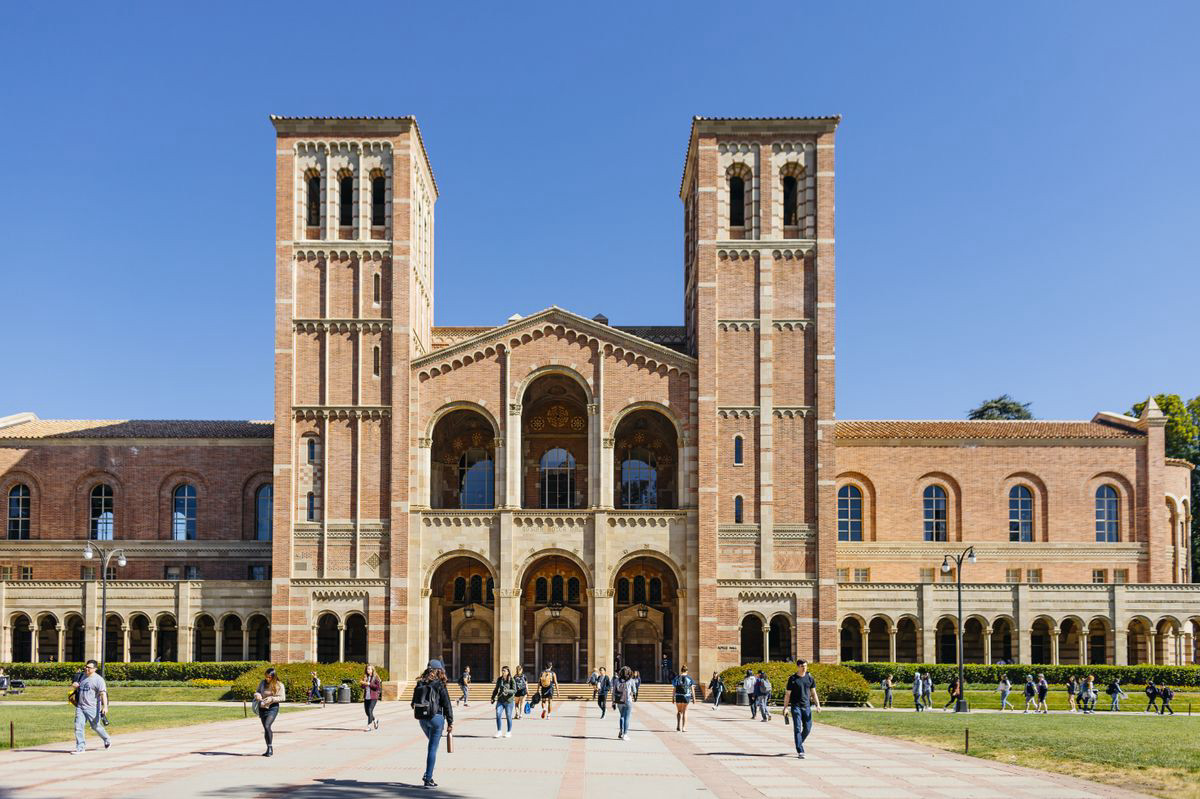 Students walking across a university campus
